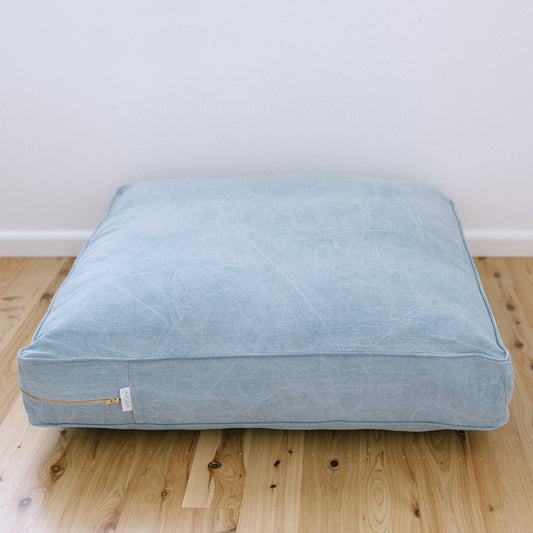 Bonnie classic stone bleached denim dog bed on timber floor