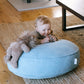baby on azure stone dog bed